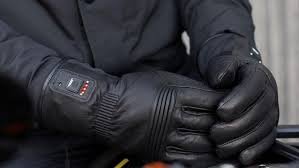 What should I look for when buying heated motorcycle gloves?